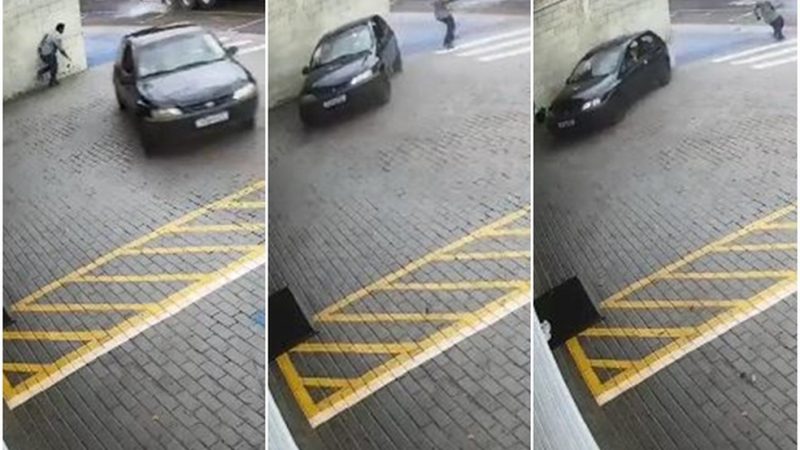 Homem percebe carro desgovernado e escapa por segundos de ser esmagado